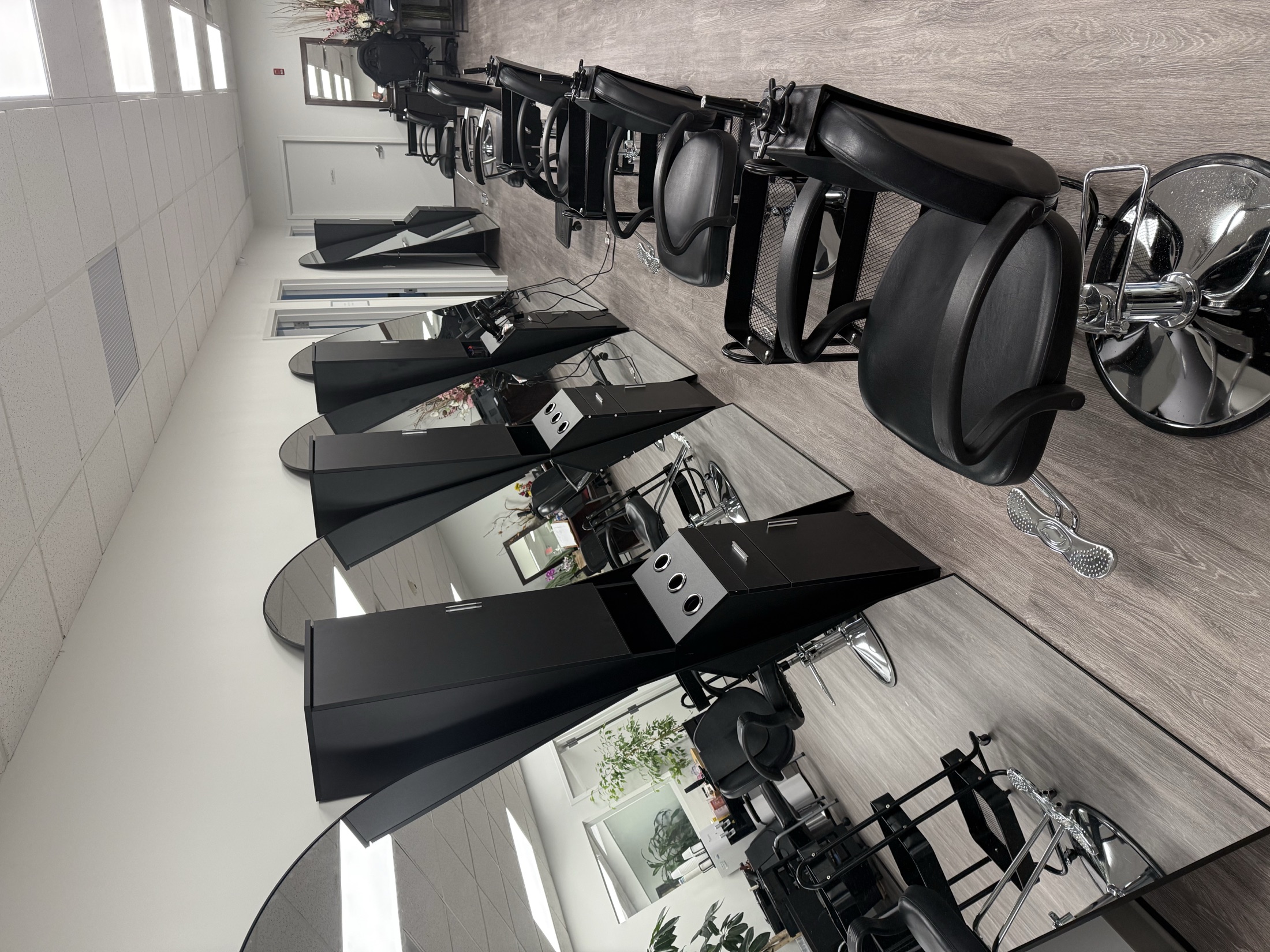 Styling stations on the salon floor at the Cosmo Beauty Academy flagship campus in Saddle Brook, New Jersey